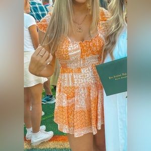 Isabelle’s Cabinet Orange & White Romper